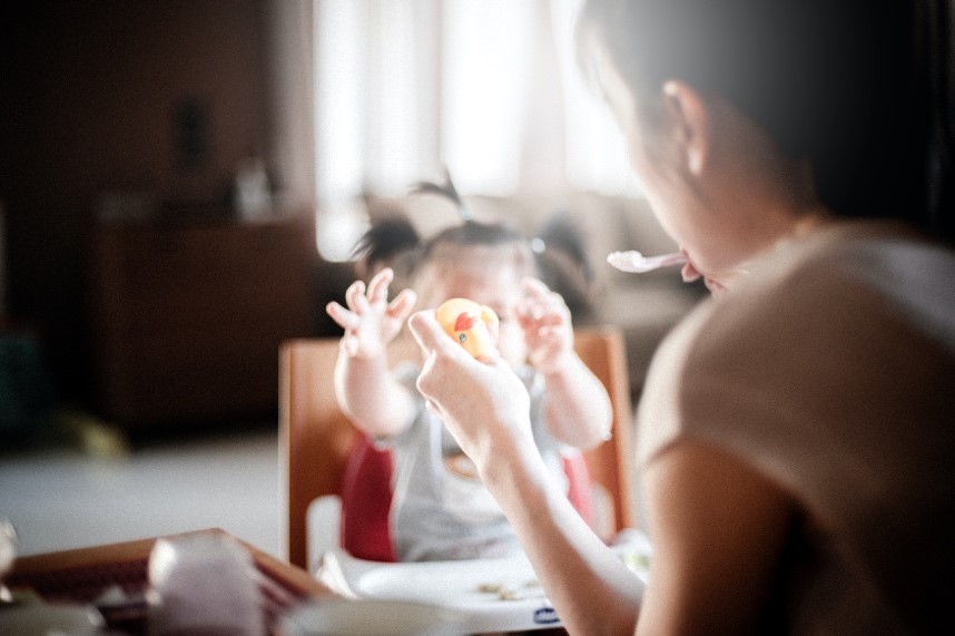 A mommy feeding a baby