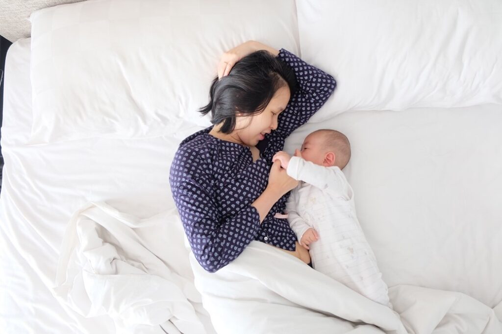 A mommy cuddling with her baby